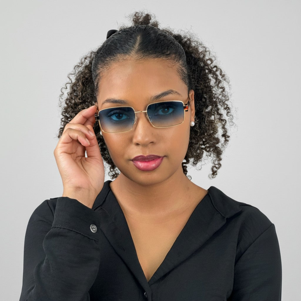 Euglasses Deméter narrow rectangular metal sunglasses with blue to yellow gradient lenses and black temple accents.